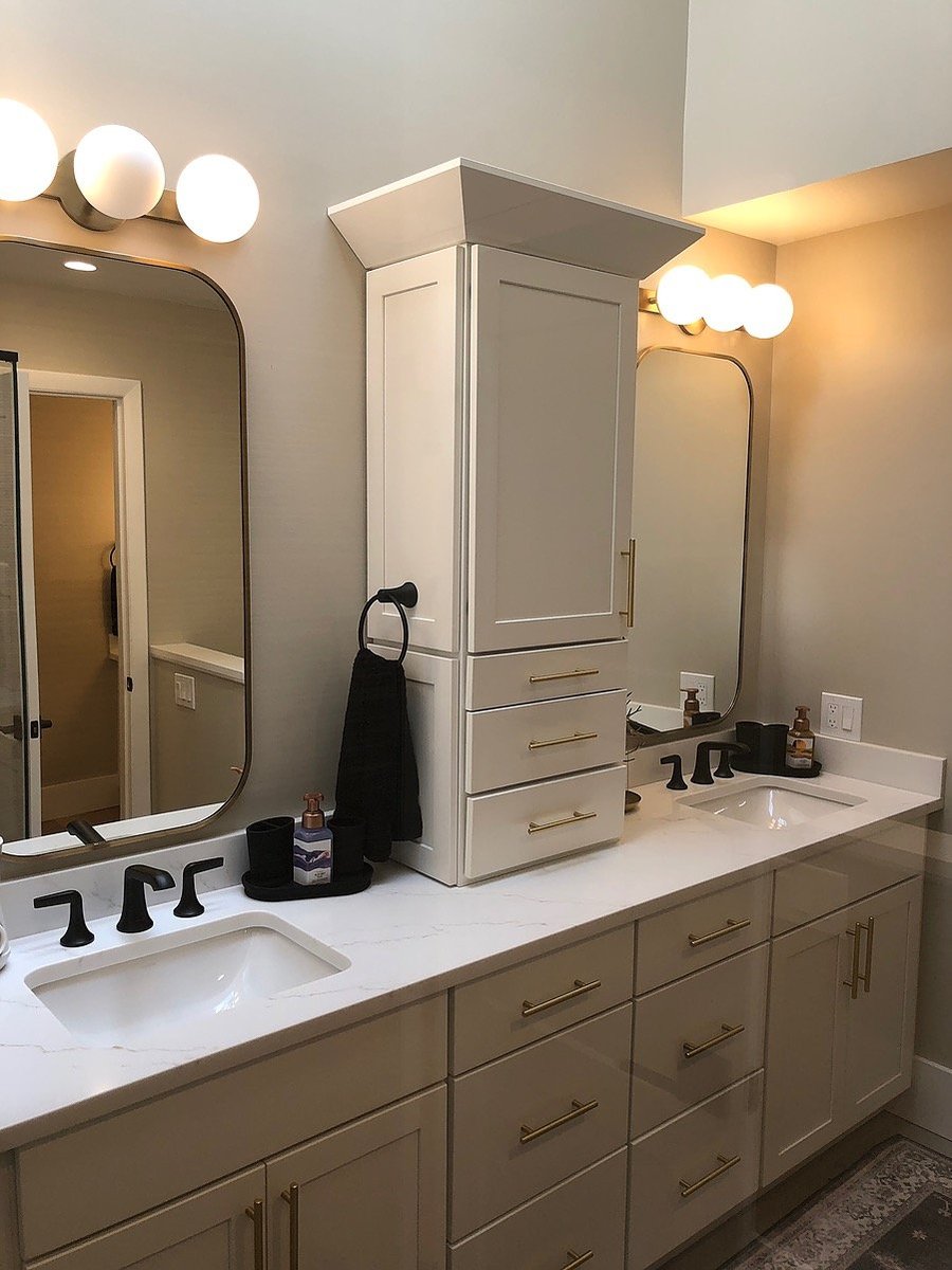 Double vanity with black faucet fixtures in Islip, NY bathroom remodel by Kuhn Construction