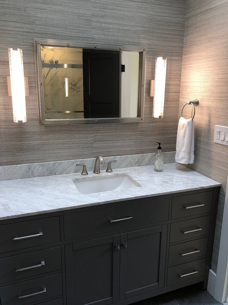 High-end bathroom vanity with under mount sink and stone countertops by Kuhn Construction