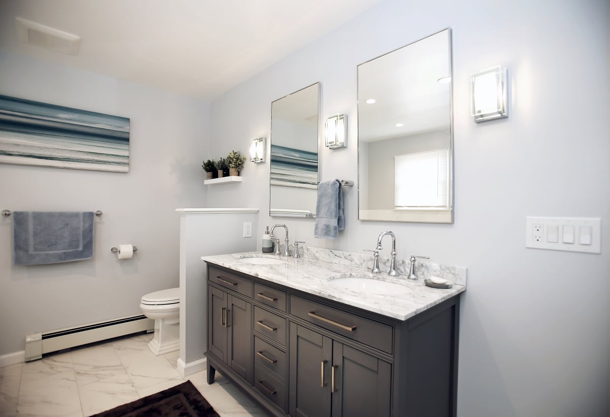 Double sinks in double vanity with marble countertops by Kuhn Construction